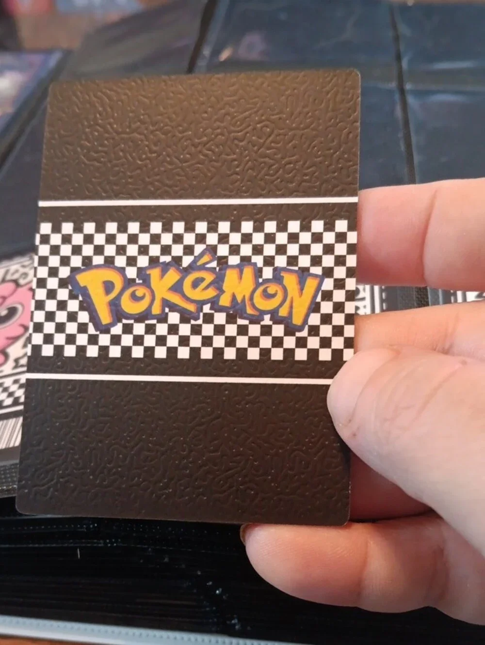 Pokemon Mimikyu Trading Card — black, yellow, orange, blue